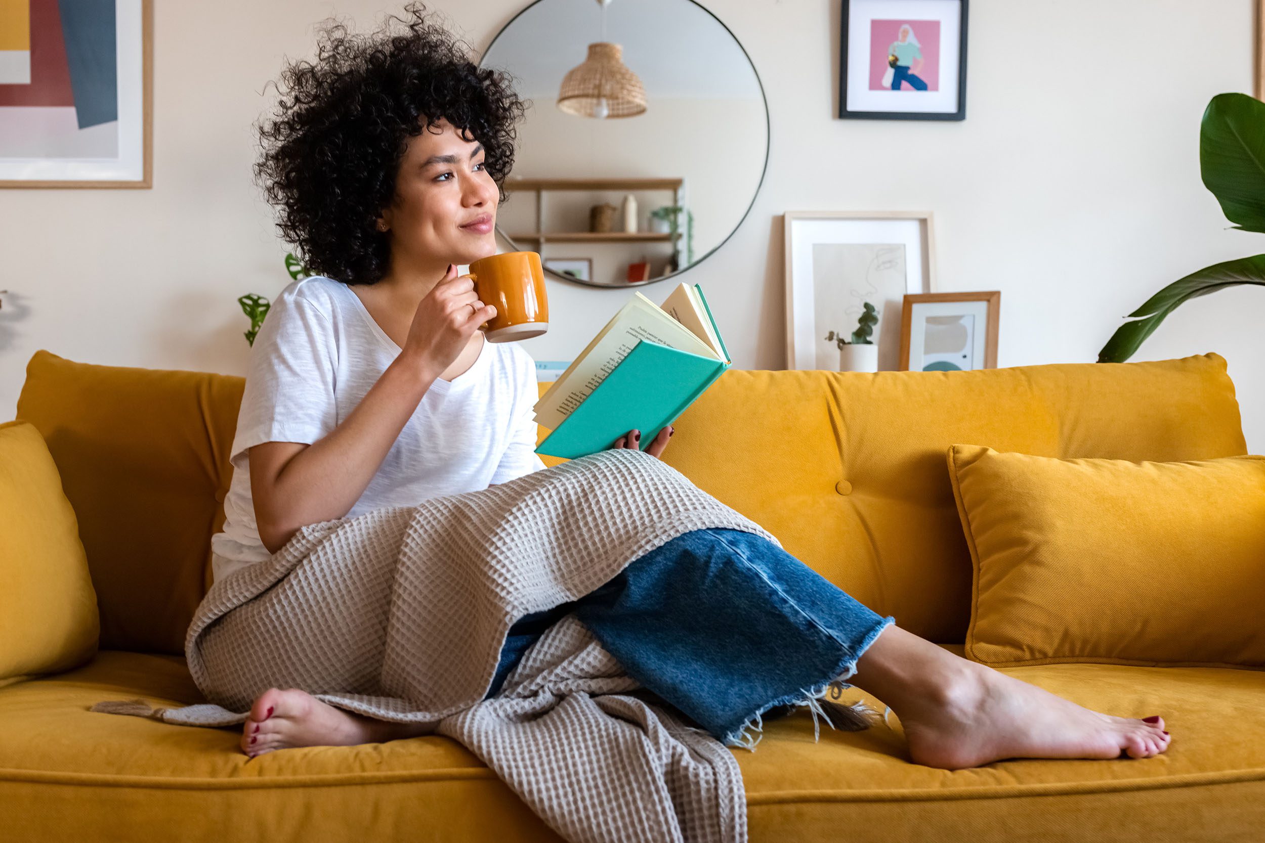 Woman enjoying coffee and a book